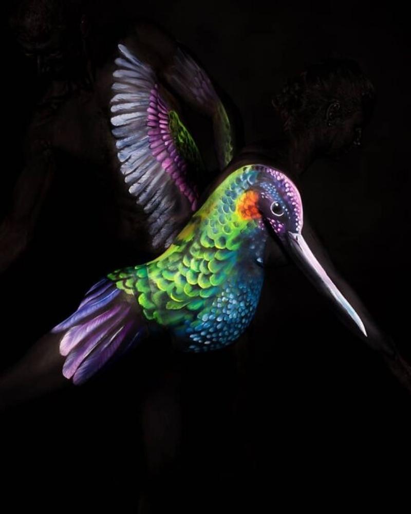 Bringing colorful birds to life is all a day in the office for body artists